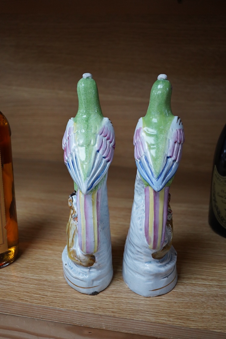 A pair of early 19th century pearlware parrots, ex John Howard, 24cm high